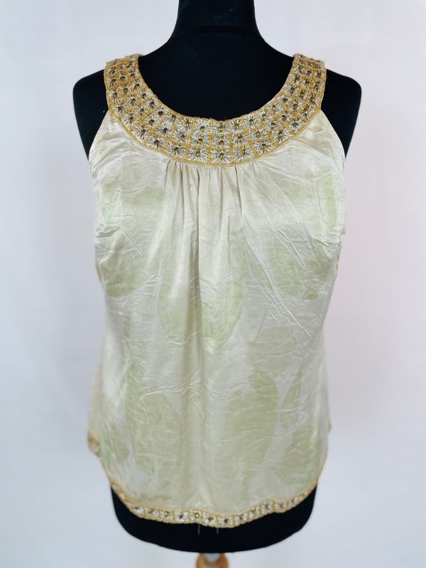 Pure silk gold sleeveles top with beaded neckline and hem. Eco printed with green peony leaves