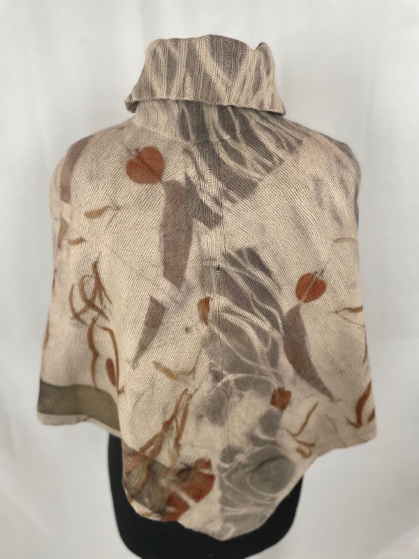 A light brown pure wool roll neck poncho originally manufactured by Monsoon.  Eco printed with three species of Eucalyptus leaves.